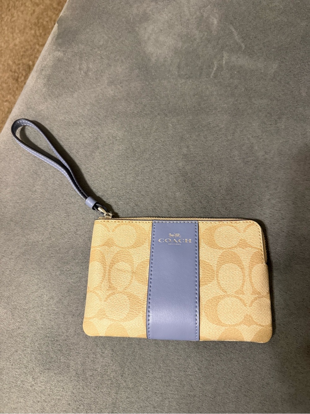 Coach Beige Signature Canvas Wristlet with light blue center stripe
